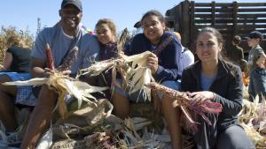 Family at Ardenwood Visitor Center assembling a corn activity