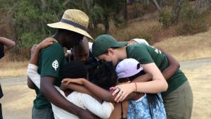 Youth embracing at Del Valle