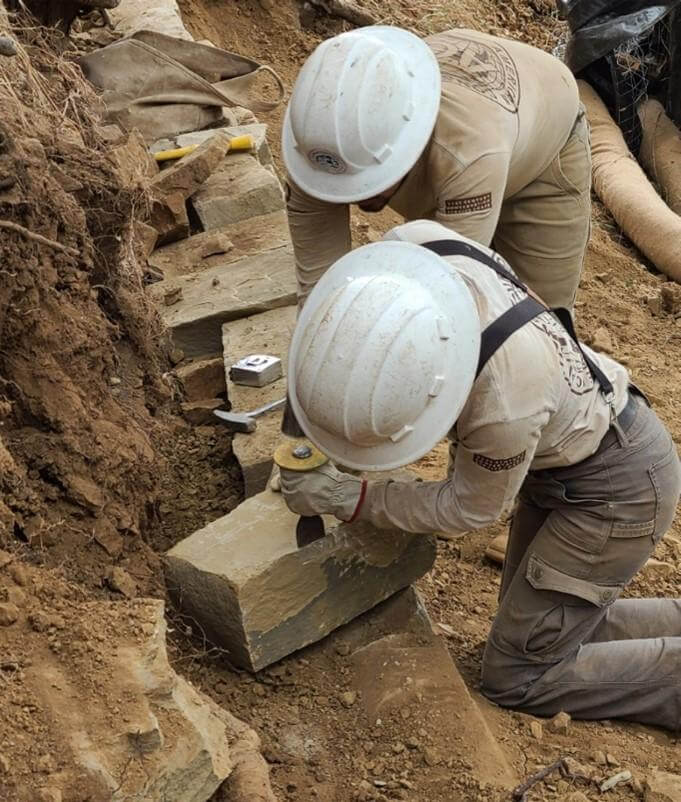 Two EBRPD workers constructing a trail